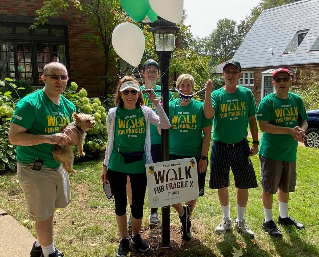 Photo of Family with green shirts supporting the Fragile X annual walk